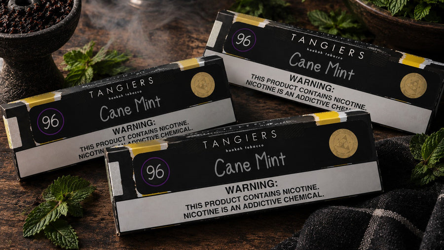 Three packs of Tangiers Cane Mint #96 shisha tobacco with fresh mint leaves